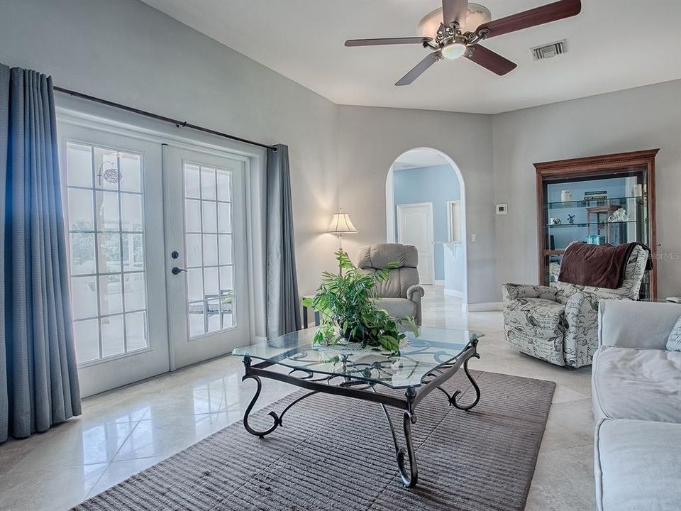 Living room with view of pretty French doors