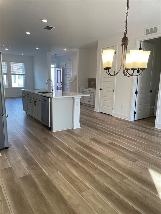 Landry room, large pantry, dry bar, 1/2 bath by front door