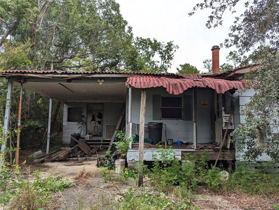 Front of the house, carport, laundry room at head of carport and the front porch.