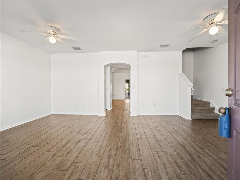 Living & dining room with wood look ceramic tile.