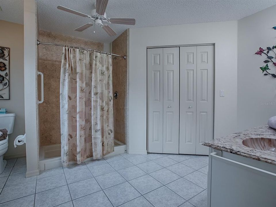 SPACIOUS MASTER BATH WITH ROOMY WALK-IN SHOWER AND DOUBLE-DOOR CLOSET