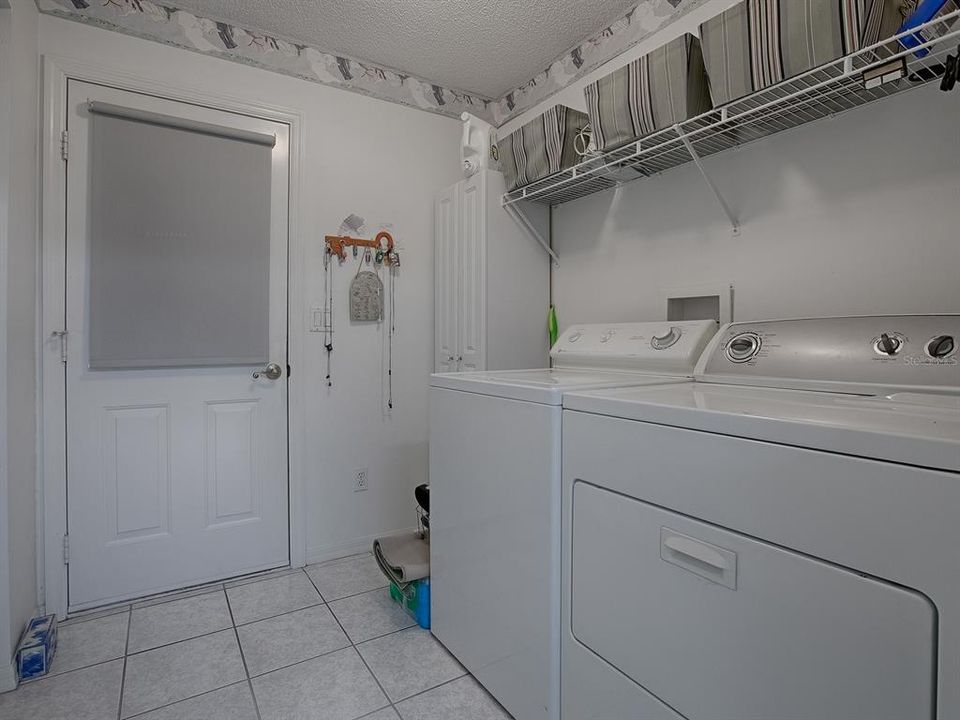 LAUNDRY ROOM WITH SHELVING AND STORAGE