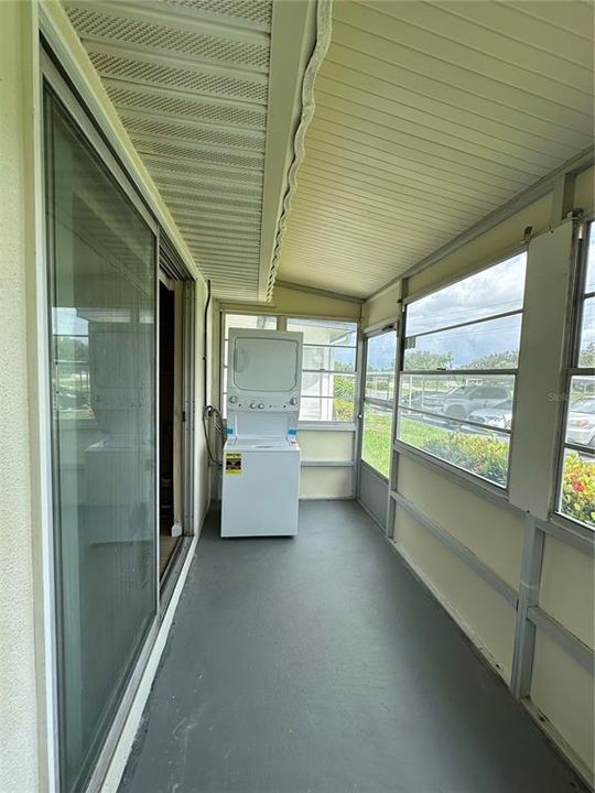 Large enclosed patio with stackable washer and dryer