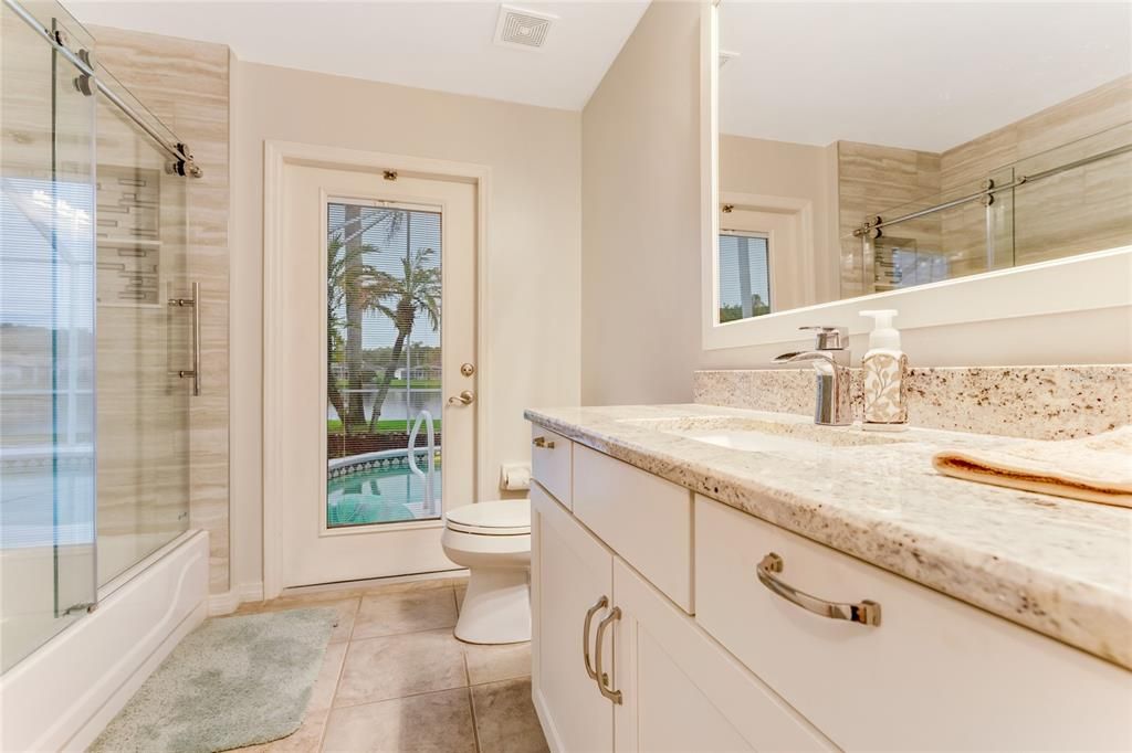 Guest / Main Bath with granite top and high-end shower enclosure