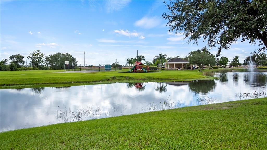 View from Front Yard.  Clubhouse, Playground, Basketball & Tennis Courts, and Pool.