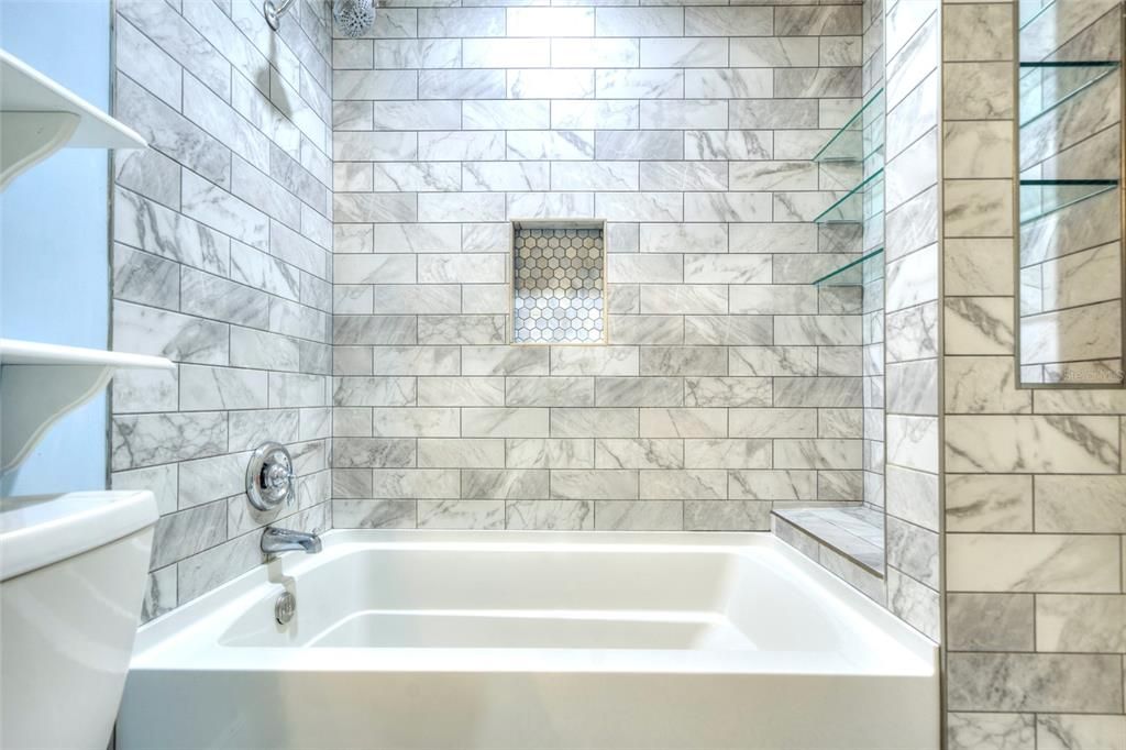 THE SHOWER TUB WITH SUPER TILE WORK