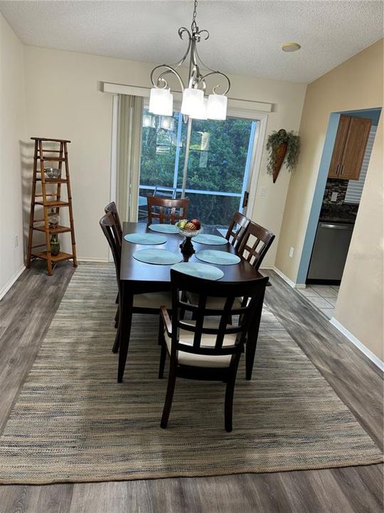 Dining area with sliders leading to birdcage