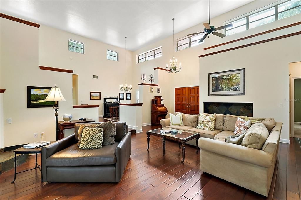 This view looks back toward the foyer and double front door. The formal dining room sits just behind the "pony walls."