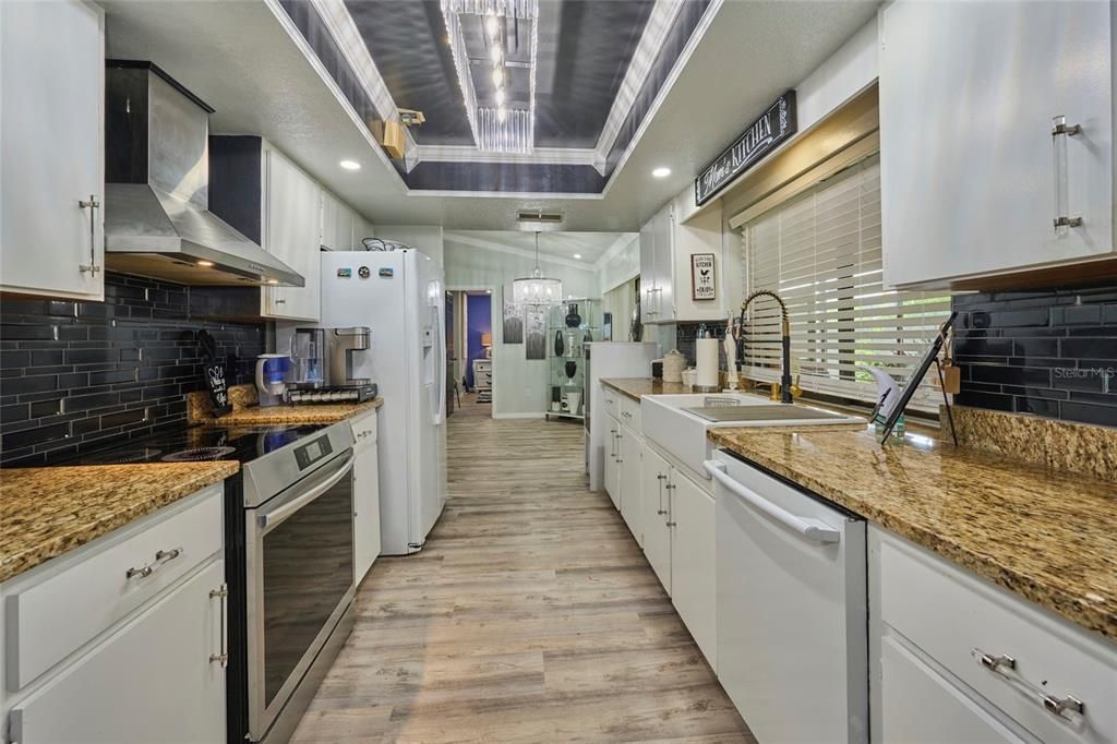 Galley style kitchen with tray ceiling