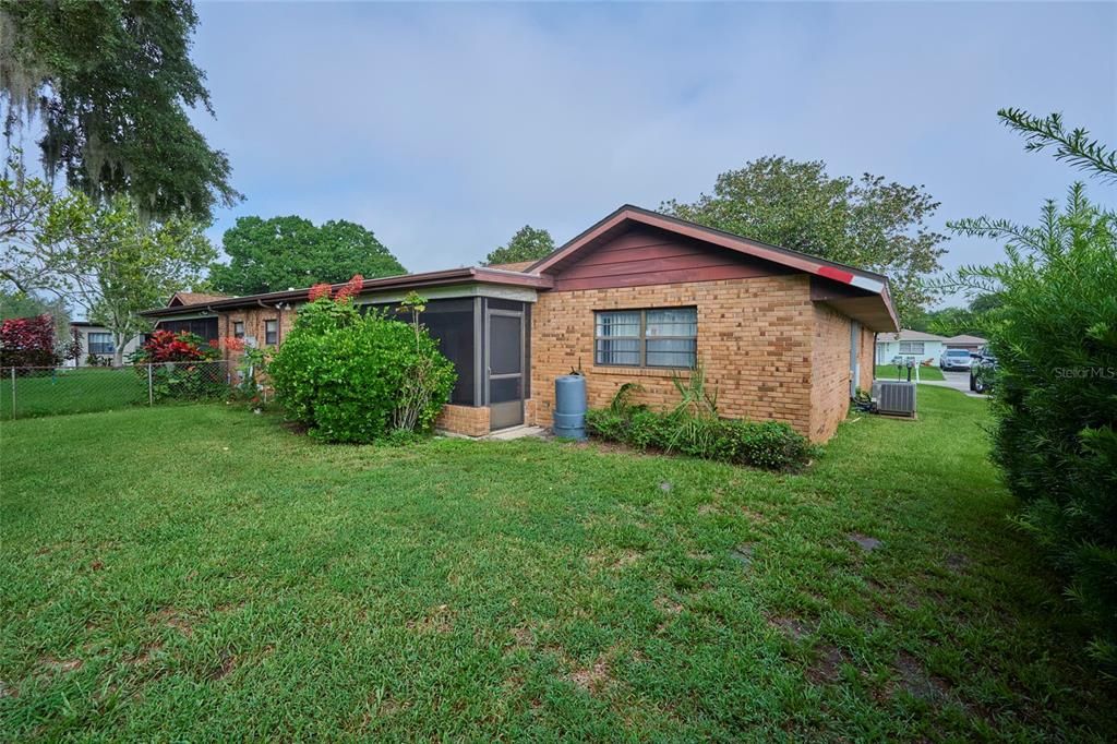 Shrubs on the side of the yard offer privacy