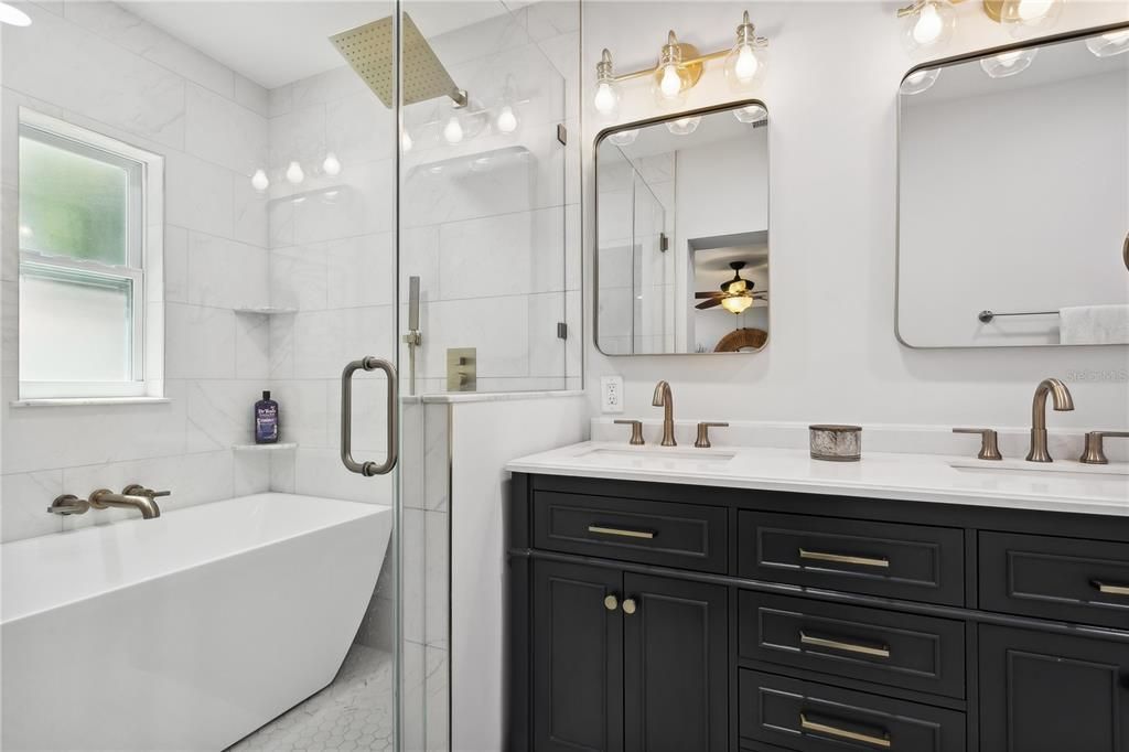 Primary en-suite bathroom with double vanity and wet room