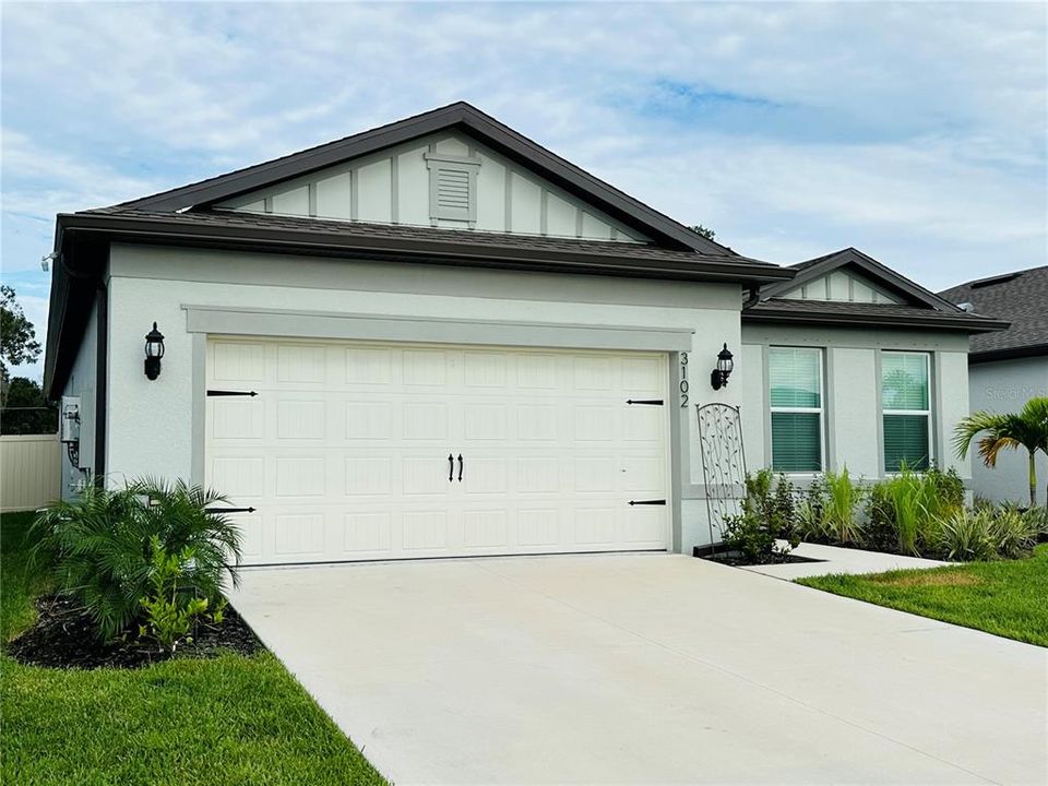 Front of the house with long and wide driveway