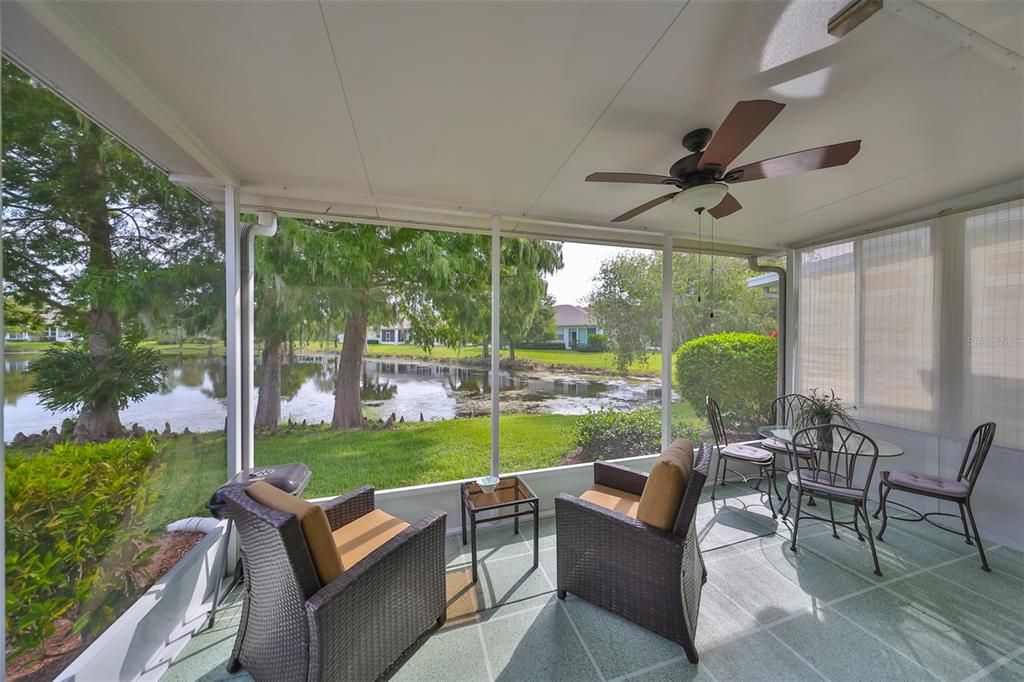 Screened in lanai with ceiling fan.