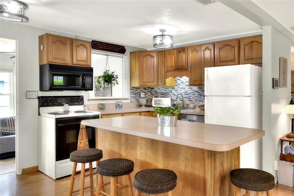 The kitchen has an island for additional eating and serving space