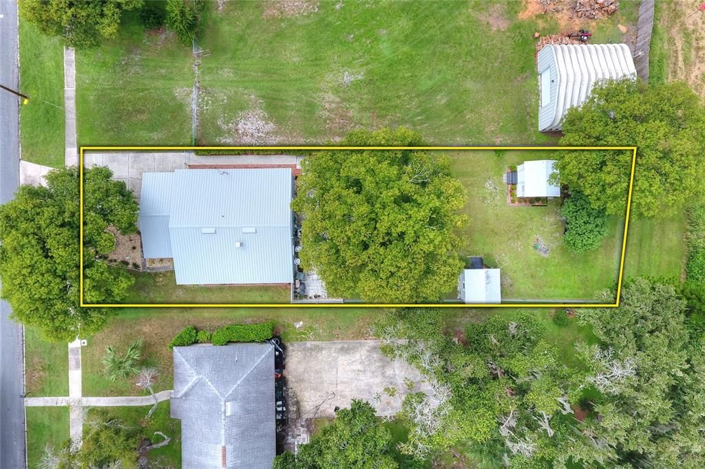 Bird's-eye view of the home with a new metal roof installed 3 years ago and approximate property lines