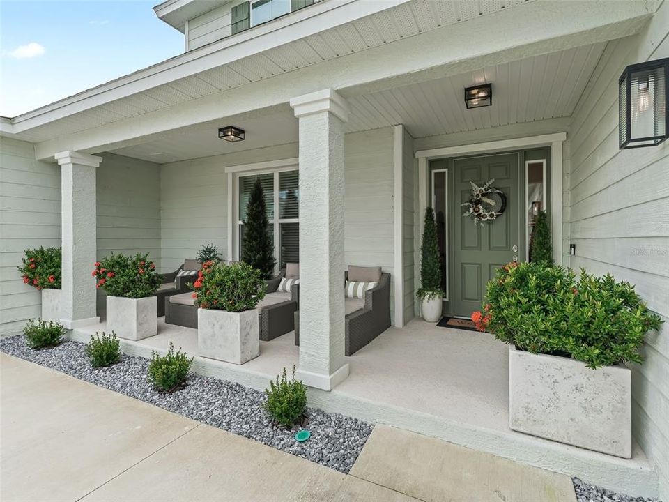 Beautifully Finished Porch - Designer Planters Convey!