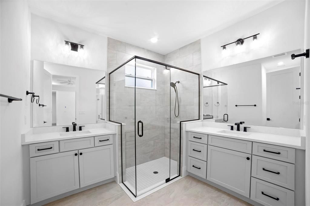 Master Bathroom with dual vanities and custom glass shower enclosure