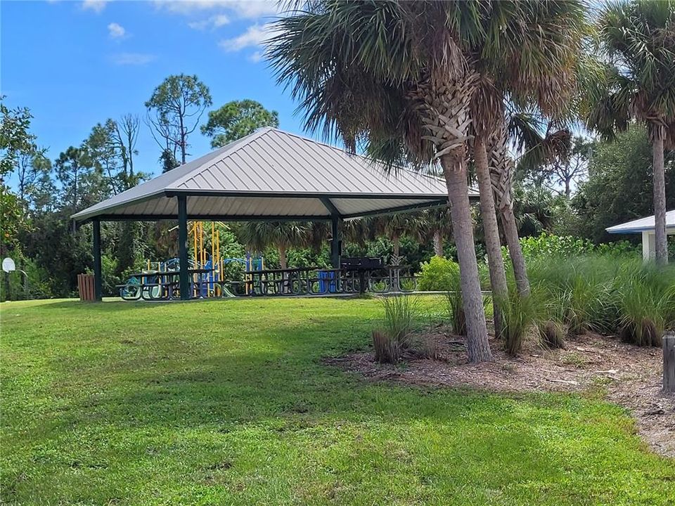 Park features picnic pavilian, playground & basketball courts.