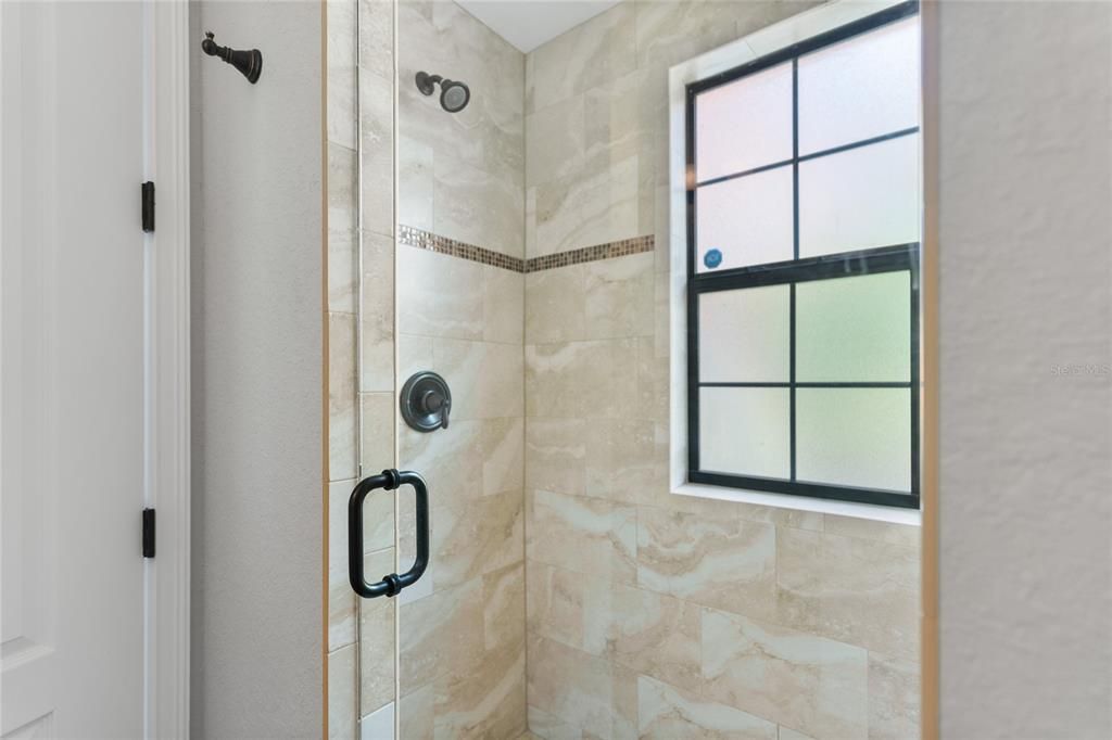 Shower/first floor bathroom across from bedroom 4