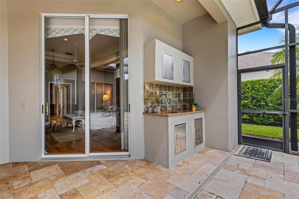 Slider to the primary bedroom, outdoor sink and cabinets for easy outdoor dining!