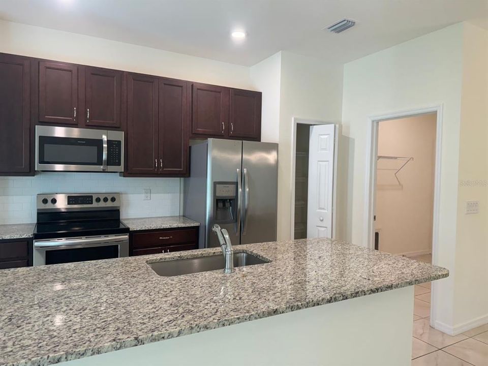 Kitchen with doorway to laundry room