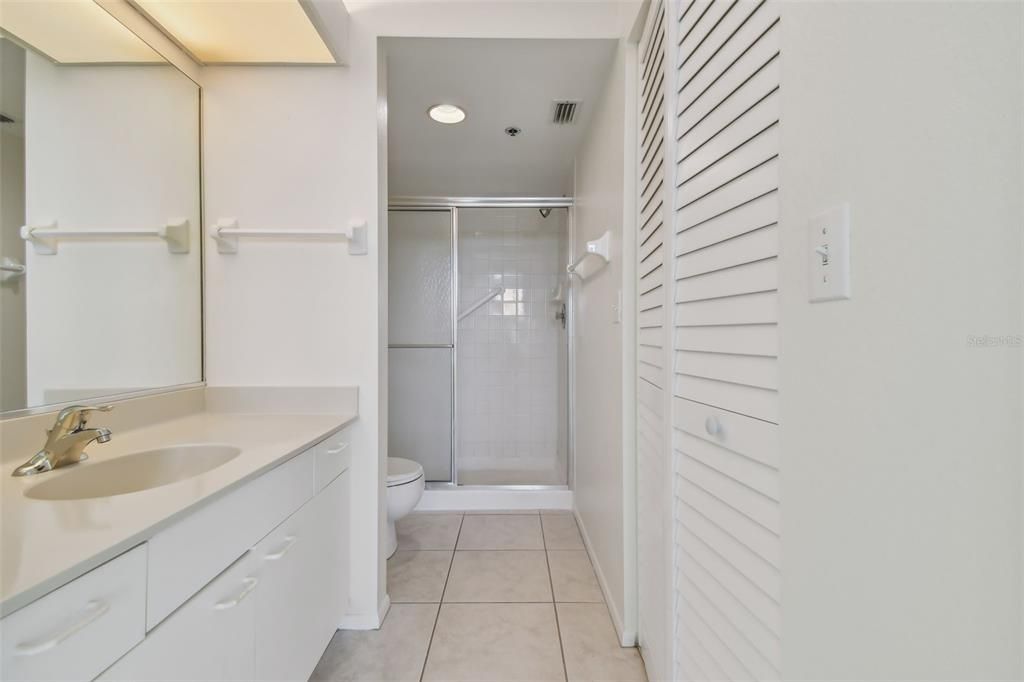 The main bathroom with a walk in shower and a 7x7 walk in closet.