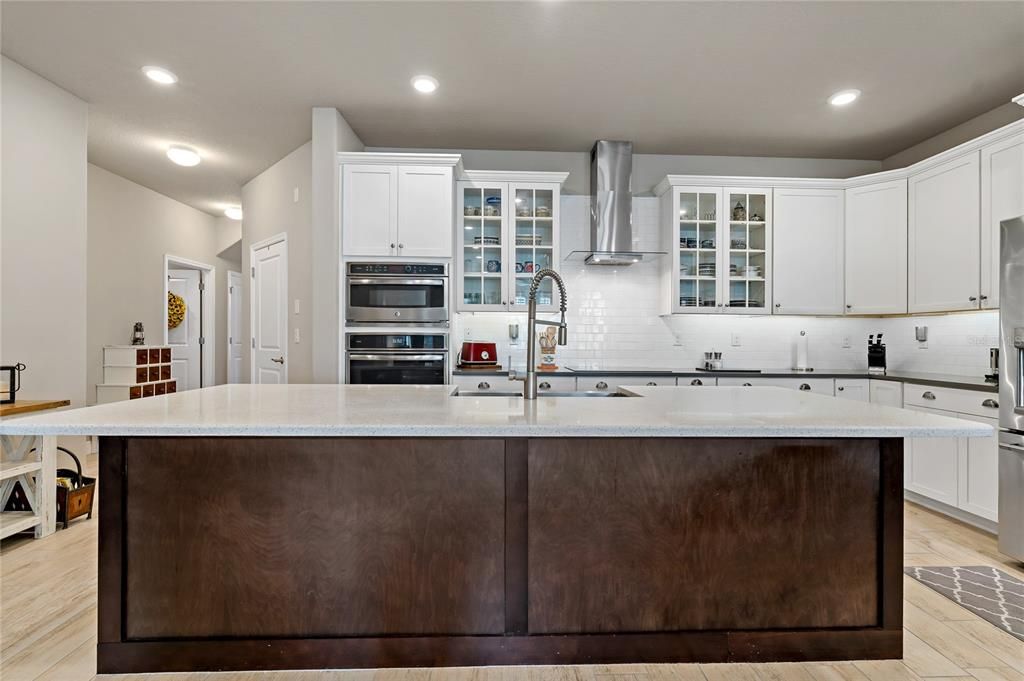 QUARTZ COUNTERTOPS AND LARGE ISLAND IN THE KITCHEN