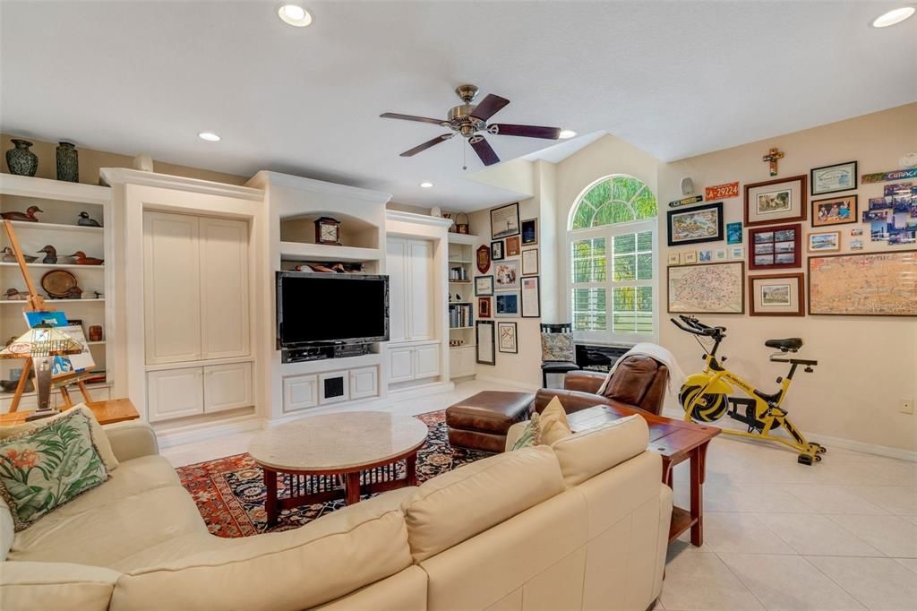 Family room with built-in shelves. TV and equipment stay!