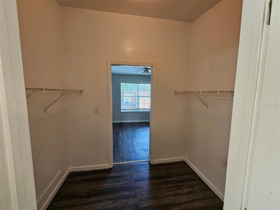 walk in closet between bedroom & bath