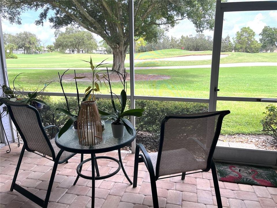 BACK LANAI WITH PAVERS AND GOLF VIEW