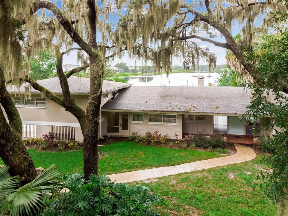 Front of Home with Lake View over the horizon.