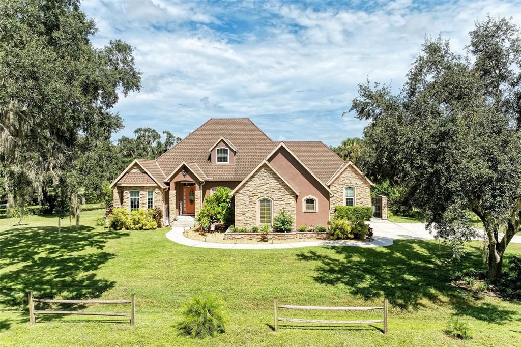 Welcome Home... just under 2.5 acres impact windows and new pool!