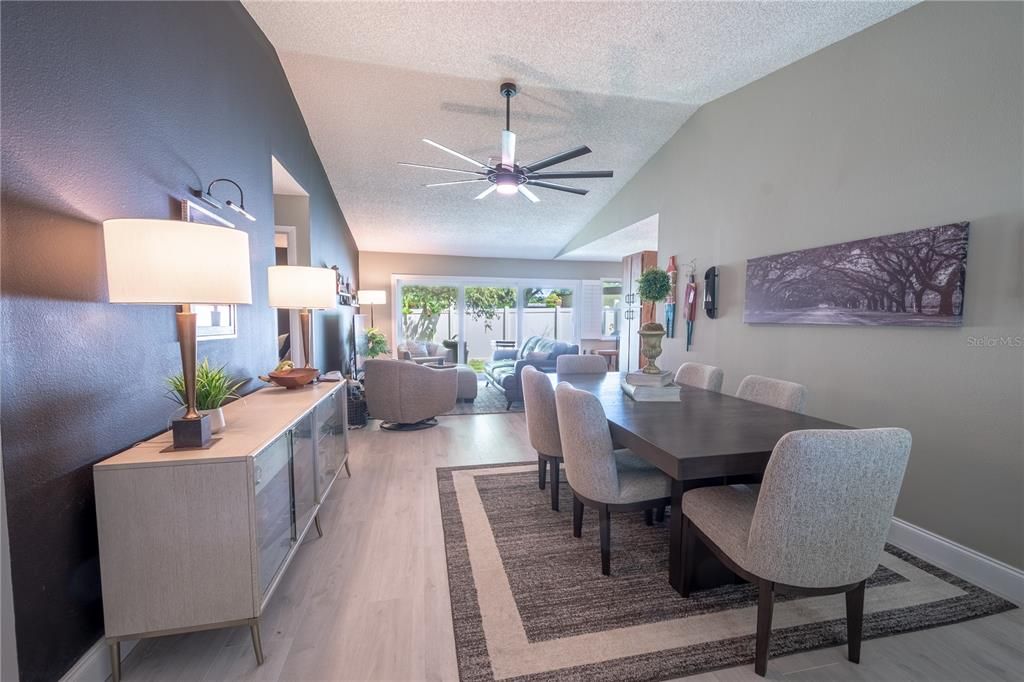 The living and dining rooms feature a modern (9-Blade) Ceiling Fan with Remote Control.