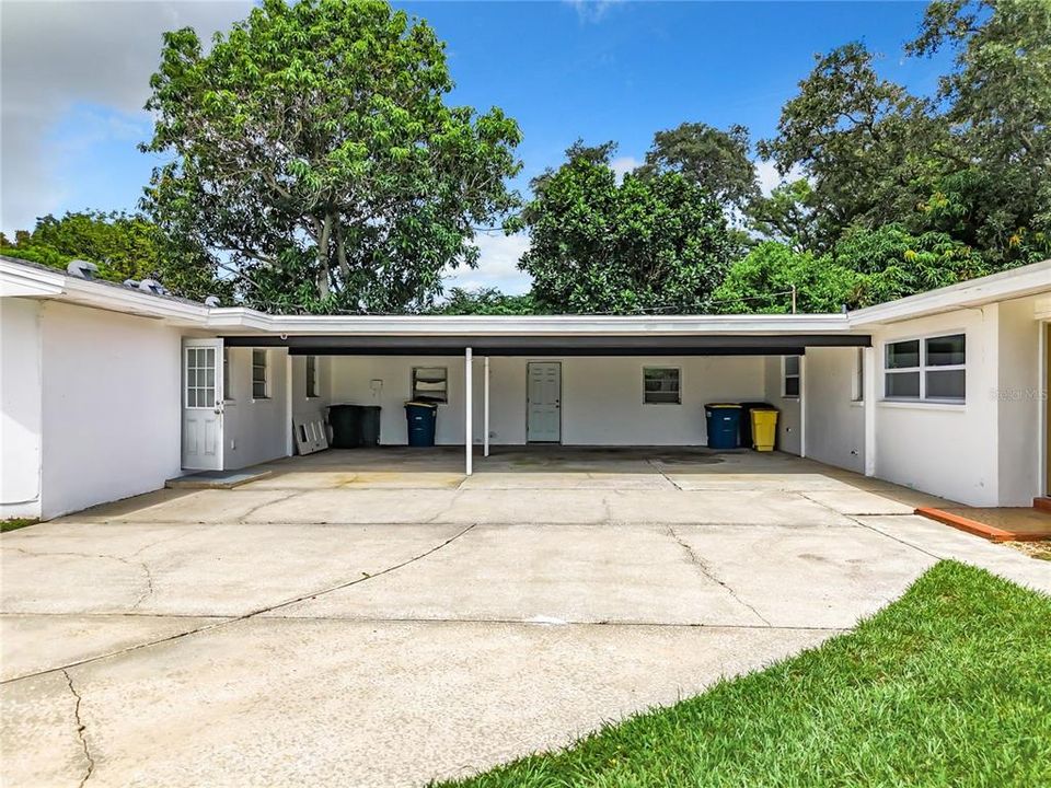 Three car carport between homes