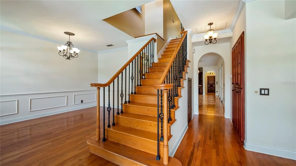 Foyer with center hall stairway