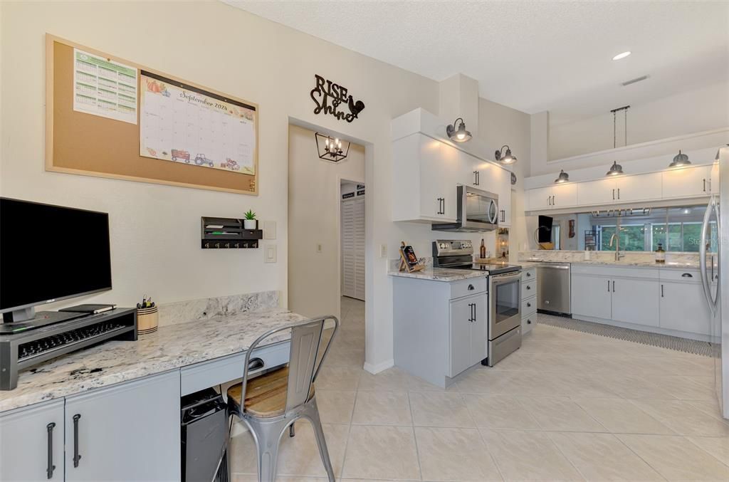 Kitchen with Granite and built in desk