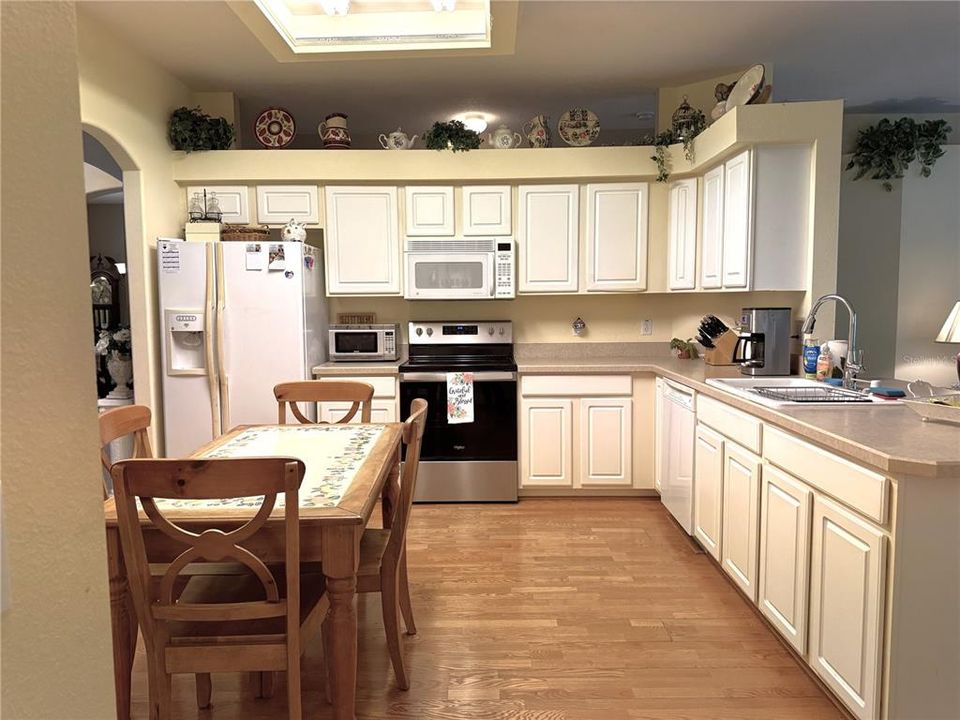 Kitchen has engineered wood floor