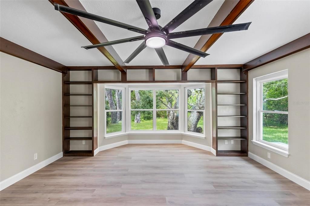 living room with built in book cases