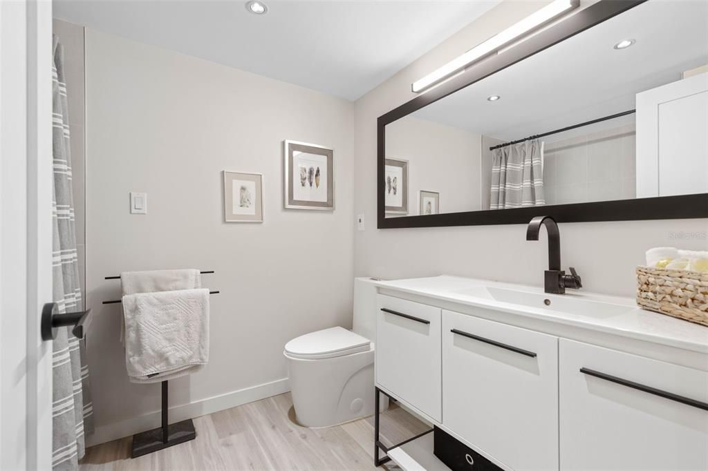 Fully updated with modern finishes - this bathroom is easily accessed from the 2nd and 3rd bedrooms