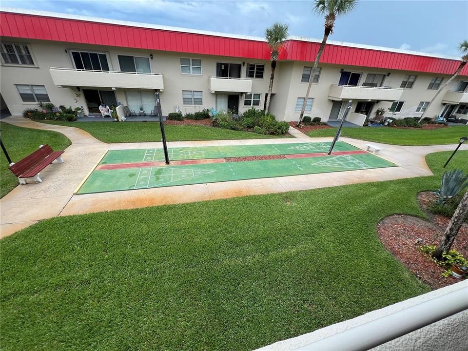 Courtyard with Shuffleboard, Pool and Halifax River Intracoastal