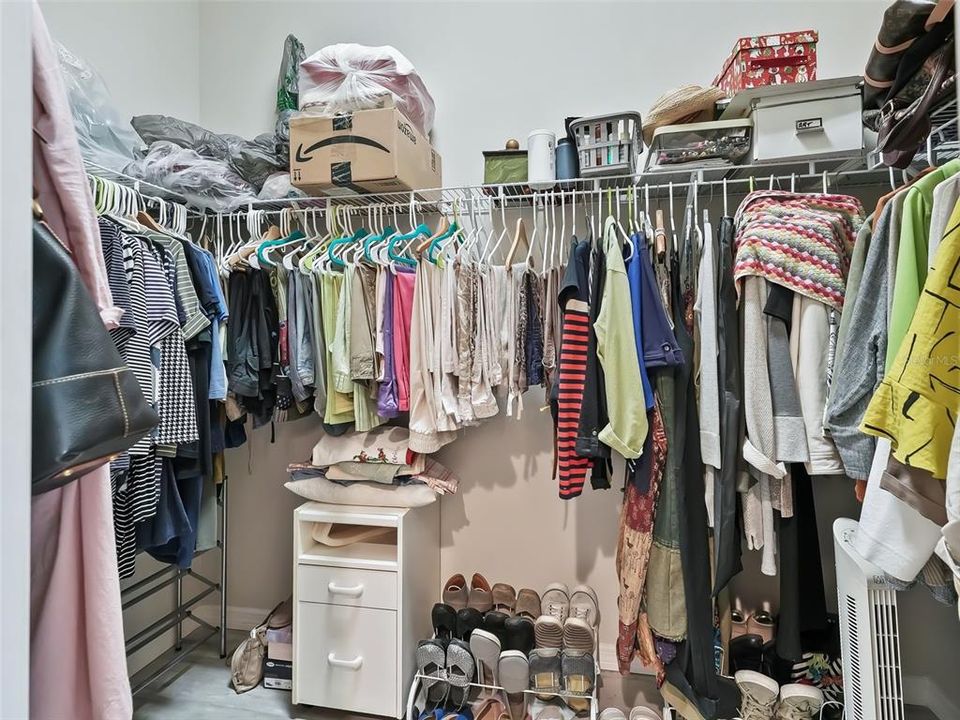 Walk-in closet in primary bathroom