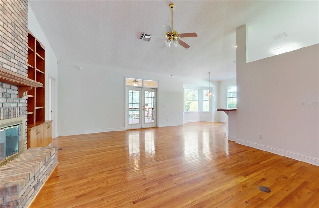 FORMAL LIVING ROOM WITH CUSTOM BUILT INS.