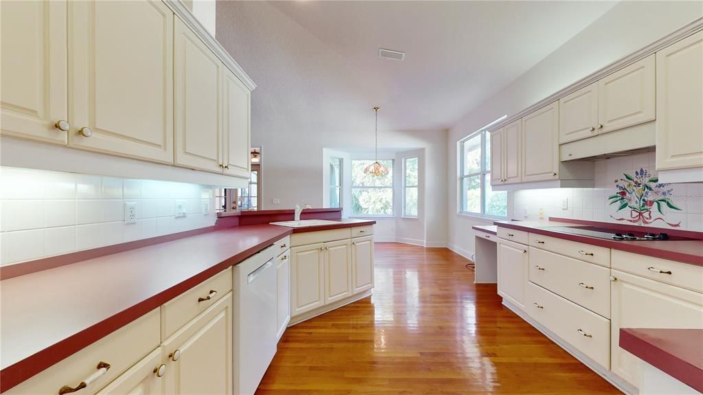 KITCHEN OVERLOOKING DINING ROOM.