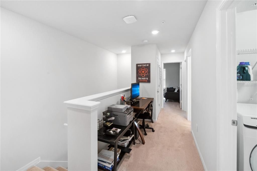 Landing at the top of the stairs with room for a study area