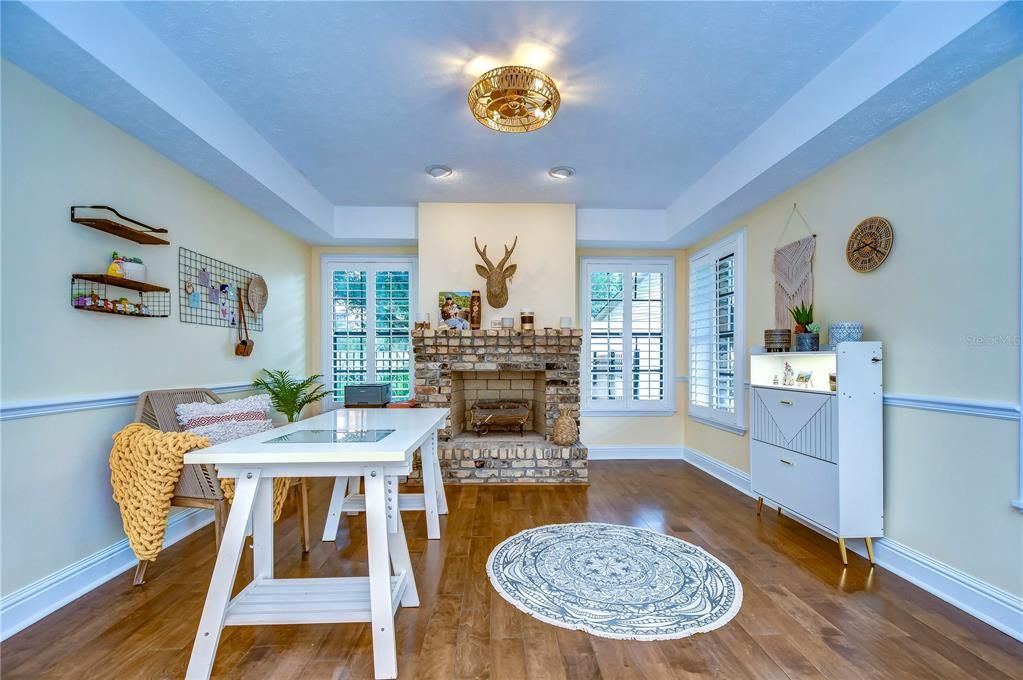 Formal living room with decorative fireplace!