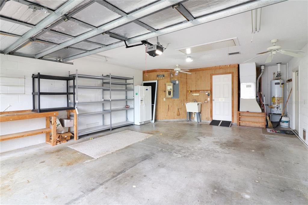 expanded 2-car garage (601 sq ft) with a utility sink and pull-down attic stairs