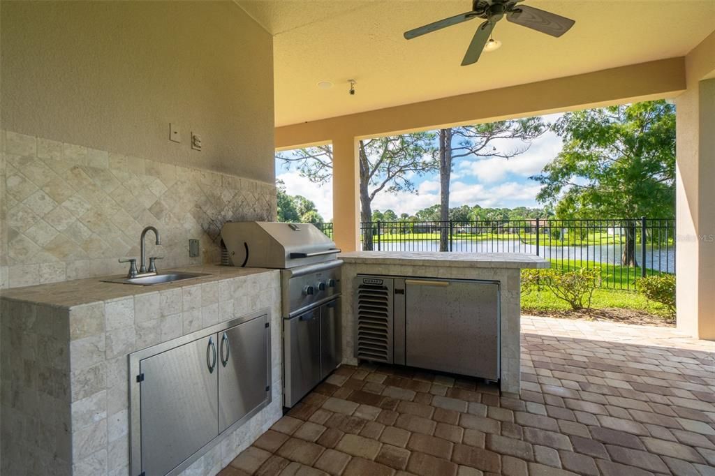 Covered patio with pavers and summer kitchen