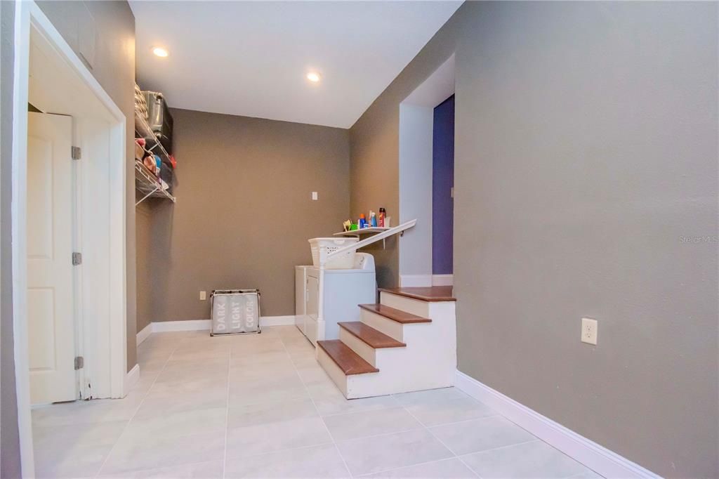 Laundry Area and Entry to Theater Room. Both Areas have brand new tile!