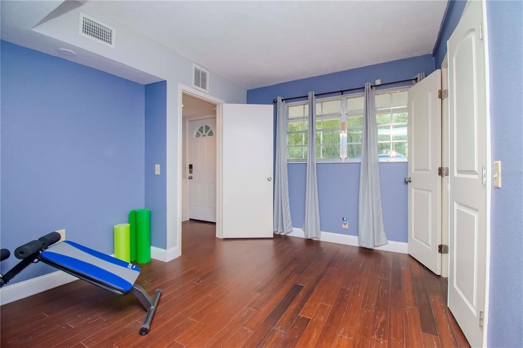 2nd Entryway Area into home. Ideal In-Law Suite Area. This area leads into 1 of 2 first floor Bedrooms. Down the hall is Full Bathroom and Newly Tiled Theater Room.