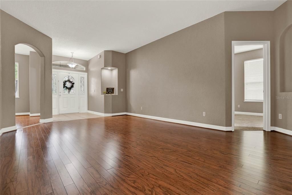 Enjoy the elegance of a formal living space with access to the master bedroom on the left side of the home.